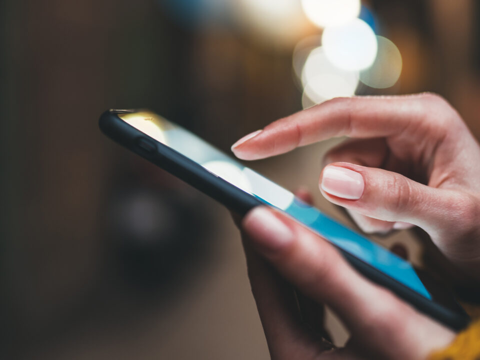 ands holding mobile phone demonstrating mobile-first approach for SA brands